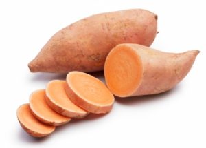 sweet potatoes with slices isolated on white